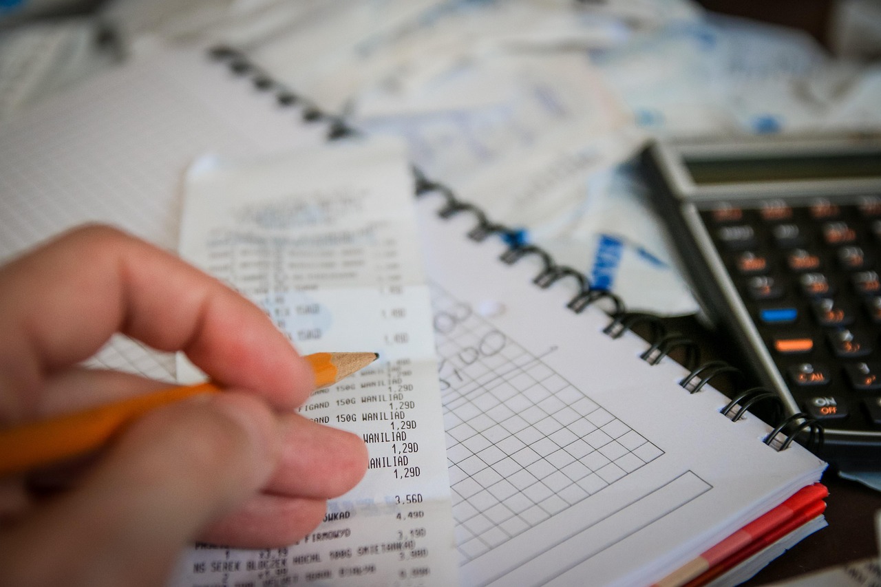 Money, bills, calculator — Exploring Top Canadian Online Marijuana Dispensaries